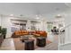 Staged living room featuring modern decor and a seamless flow to the dining area at 9006 Cedar Door Ave, Las Vegas, NV 89148