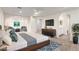 Bright main bedroom with ceiling fan, sitting area, en-suite bathroom and walk-in closet at 9006 Cedar Door Ave, Las Vegas, NV 89148