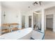 Spa-like bathroom featuring a standalone tub, modern fixtures, and natural light. Great potential! at 9319 White Waterfall Ave, Las Vegas, NV 89149
