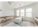 Elegant bathroom with standalone tub, bright windows, and wood-look flooring at 9319 White Waterfall Ave, Las Vegas, NV 89149