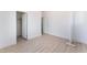 An expansive bedroom showcases light wood floors, neutral walls, and an open closet at 9319 White Waterfall Ave, Las Vegas, NV 89149