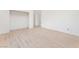 This large bedroom features modern flooring and an open closet space at 9319 White Waterfall Ave, Las Vegas, NV 89149