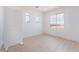 Bright bedroom with modern flooring, crisp white walls, and multiple windows for natural light at 9319 White Waterfall Ave, Las Vegas, NV 89149