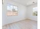 Bright bedroom with ample windows offers natural light and scenic neighborhood views at 9319 White Waterfall Ave, Las Vegas, NV 89149