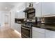 Well-equipped kitchen boasts stainless steel appliances and dark countertops at 9319 White Waterfall Ave, Las Vegas, NV 89149