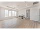 Spacious living room featuring a sleek fireplace, recessed lighting, and light wood floors at 9319 White Waterfall Ave, Las Vegas, NV 89149