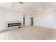 Modern living room with a stylish fireplace, recessed lighting, and open floor plan at 9319 White Waterfall Ave, Las Vegas, NV 89149