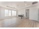 Spacious living room featuring a sleek fireplace, recessed lighting, and light wood floors at 9319 White Waterfall Ave, Las Vegas, NV 89149