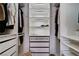 Organized closet with drawers and shelves featuring built-in lighting to display your finest clothes at 9333 Dry Dock Dr, Las Vegas, NV 89117