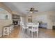 Bright dining area with ceiling fan and view of the fireplace at 9333 Dry Dock Dr, Las Vegas, NV 89117