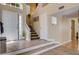 Bright foyer features beautiful flooring, staircase, and natural light at 9333 Dry Dock Dr, Las Vegas, NV 89117