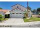 Charming two-story home featuring a well-maintained lawn, a two-car garage, and a classic red tile roof at 9333 Dry Dock Dr, Las Vegas, NV 89117