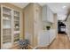 Hallway featuring built-in shelving, cabinets, and wood flooring, perfect for storage and display at 9333 Dry Dock Dr, Las Vegas, NV 89117