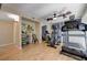 Workout room featuring gym equipment, mirrors, and hardwood floors, perfect for staying active at home at 9333 Dry Dock Dr, Las Vegas, NV 89117