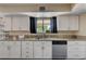Updated kitchen boasts stainless steel appliances, granite countertops, and bright white cabinetry at 9333 Dry Dock Dr, Las Vegas, NV 89117