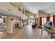 Open-concept living area flows to outdoor pool with brick fireplace and abundant natural light at 9333 Dry Dock Dr, Las Vegas, NV 89117