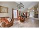 Spacious living room with vaulted ceilings, large windows, and stylish decor at 9333 Dry Dock Dr, Las Vegas, NV 89117