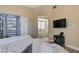 Bedroom view showcasing a large walk-in closet and a glimpse into the ensuite bathroom at 9333 Dry Dock Dr, Las Vegas, NV 89117