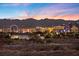 Spectacular Las Vegas skyline featuring the High Roller and iconic hotels, set against a colorful sunset backdrop at 9605 Verlaine Ct, Las Vegas, NV 89145