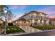 Spacious home with a three-car garage, well-manicured lawn and landscape, and a paved driveway at 9605 Verlaine Ct, Las Vegas, NV 89145