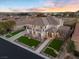 Elegant home featuring a well-kept front yard, stone facade, and covered entrance, reflecting refined living at 9605 Verlaine Ct, Las Vegas, NV 89145