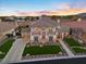 Stunning home exterior with manicured lawns, stone accents, and a circular driveway, radiating curb appeal at 9605 Verlaine Ct, Las Vegas, NV 89145