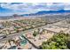 A sprawling community featuring single Gathering homes amid desert landscaping with a backdrop of scenic mountains at 9660 W Ann Rd, Las Vegas, NV 89149
