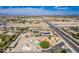 Panoramic aerial view highlighting neighborhood, lush trees, and property's features at 9660 W Ann Rd, Las Vegas, NV 89149