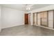Bedroom features gray ceramic tile flooring, ceiling fan and closet at 9660 W Ann Rd, Las Vegas, NV 89149
