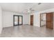The bedroom boasts tile floors and French doors for natural light and access to the backyard swimming pool at 9660 W Ann Rd, Las Vegas, NV 89149