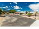Spacious driveway with parking and mature landscaping enhancing curb appeal at 9660 W Ann Rd, Las Vegas, NV 89149