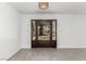 Elegant foyer featuring a decorative wrought iron door and chandelier, providing a warm welcome at 9660 W Ann Rd, Las Vegas, NV 89149