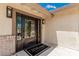 Elegant front entrance with an ornate metal security door and welcome mat at 9660 W Ann Rd, Las Vegas, NV 89149