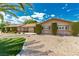 Attractive single-story home showcasing desert landscaping, mature shrubs, and a manicured lawn at 9660 W Ann Rd, Las Vegas, NV 89149