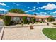 Well-maintained home exterior with decorative landscaping, mature trees, and inviting facade at 9660 W Ann Rd, Las Vegas, NV 89149