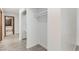 Hallway features a closet and bathroom access. Ceramic tile featured throughout the hallway at 9660 W Ann Rd, Las Vegas, NV 89149