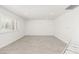 Bright and spacious living room with tile flooring, fresh paint, and natural light at 9660 W Ann Rd, Las Vegas, NV 89149