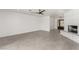 Bright living room features a painted brick fireplace and tile flooring at 9660 W Ann Rd, Las Vegas, NV 89149