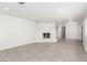 Open concept living room features a painted fireplace and tile flooring at 9660 W Ann Rd, Las Vegas, NV 89149