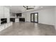 Open floor plan living room with fireplace, tile flooring and pool access at 9660 W Ann Rd, Las Vegas, NV 89149