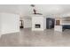Open concept living room offers fireplace and seamless access to kitchen at 9660 W Ann Rd, Las Vegas, NV 89149