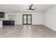 Open floor plan living room with tile flooring and access to the pool at 9660 W Ann Rd, Las Vegas, NV 89149