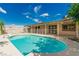 Sparkling pool and spa with backyard covered patio perfect for relaxing poolside at 9660 W Ann Rd, Las Vegas, NV 89149