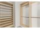 Spacious walk-in closet features built-in shelving units and hanging rods at 9660 W Ann Rd, Las Vegas, NV 89149