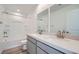 Bright bathroom featuring a double sink vanity, a tub with shower, and modern fixtures at 9842 Lost Horse Ave, Las Vegas, NV 89178