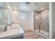 Modern bathroom featuring double sinks, a glass-enclosed shower, and contemporary fixtures at 9842 Lost Horse Ave, Las Vegas, NV 89178