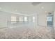 Large loft space with plush carpeting, natural light, and ample room for various activities at 9842 Lost Horse Ave, Las Vegas, NV 89178