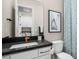 Chic bathroom featuring a black countertop, gold fixtures, and patterned shower curtain at 12212 Elderwood St, Las Vegas, NV 89138