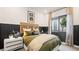 Stylish bedroom with natural light, UNLV decor, and modern bedside tables at 12212 Elderwood St, Las Vegas, NV 89138