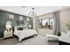 Serene bedroom with a large window, sleek furniture, and a soothing color scheme at 12212 Elderwood St, Las Vegas, NV 89138